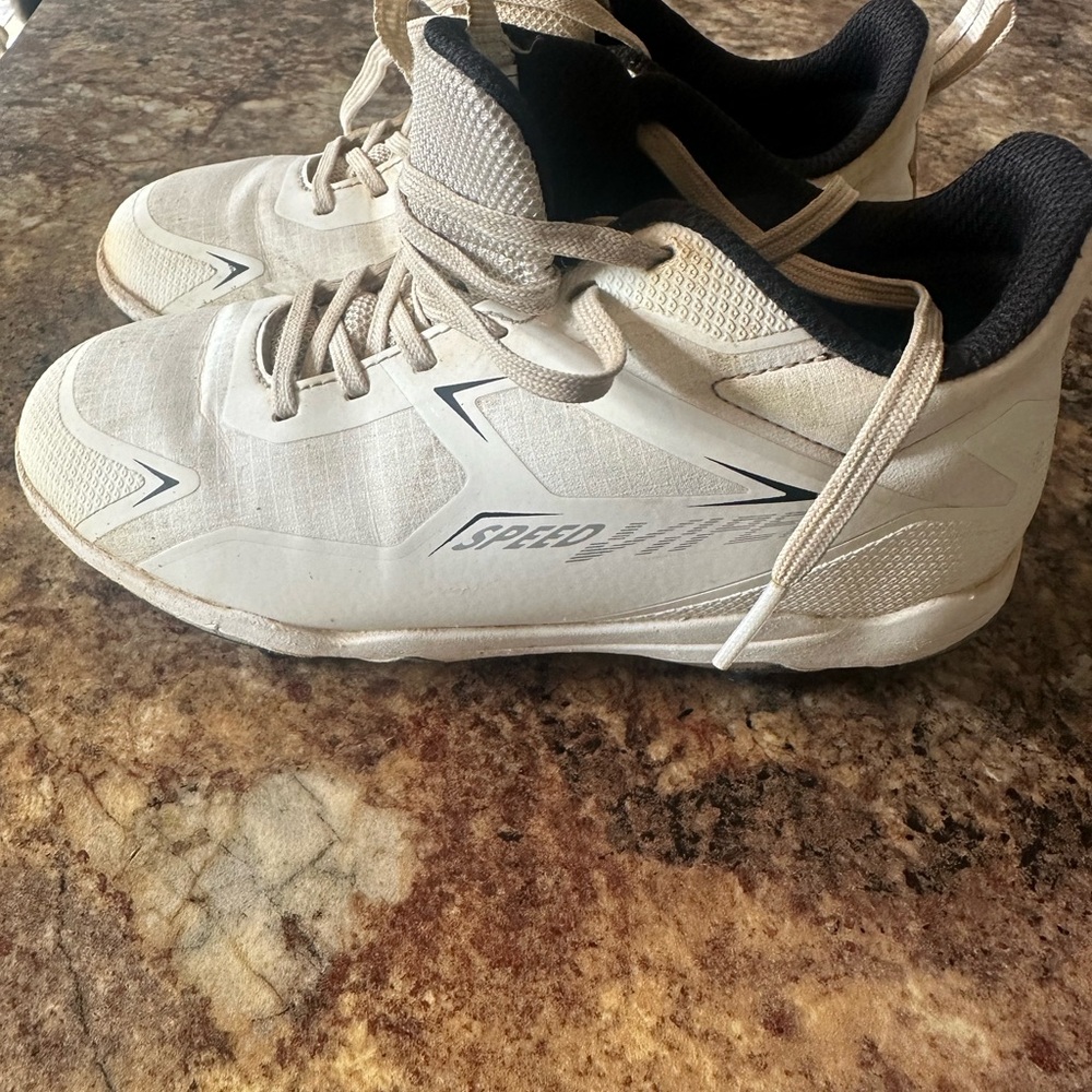 DSG Boy’s White baseball cleats.